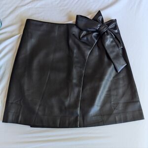 Vegan leather mini skirt with a bow